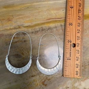 Handmade item, hammered, allergy free plated silver, locking latch back.